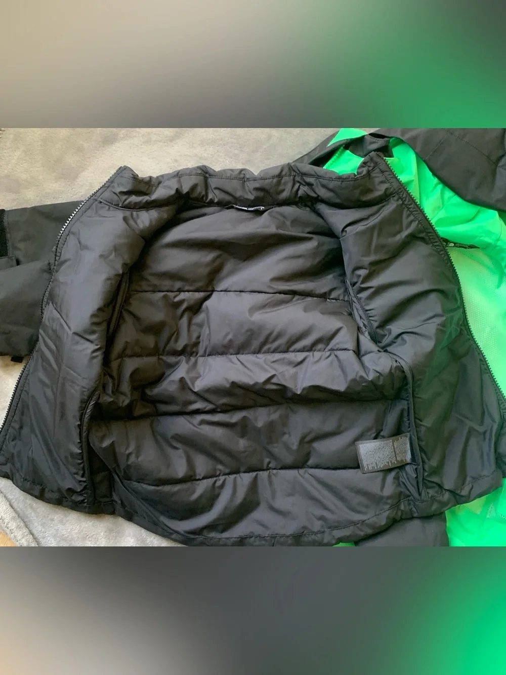 The North Face Black Hooded Jacket with Green Lining & Pink Zippers